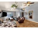 Bright living room showcasing tile floors, a plush grey sofa, and decor at 4616 E Gold Poppy Way, Phoenix, AZ 85044