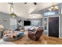 Cozy living room with vaulted ceilings, tile flooring, and comfortable seating arrangement at 4616 E Gold Poppy Way, Phoenix, AZ 85044