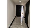 Bright entryway features sleek marble flooring and a modern front door with glass panes, creating an inviting entrance at 4830 N 72Nd Way, Scottsdale, AZ 85251