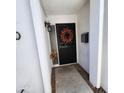 Inviting front entryway featuring a security door with an autumnal wreath, offering both style and protection at 4830 N 72Nd Way, Scottsdale, AZ 85251