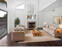 Bright living room with fireplace, neutral tones, and contemporary design at 5976 W Alameda Rd, Glendale, AZ 85310