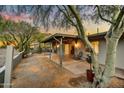Desert landscaped backyard with covered patio and mountain views, perfect for outdoor living at 6002 E Cholla Rd, Cave Creek, AZ 85331