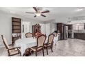 Elegant dining room, open floor plan, with view of kitchen and dining table. Well-lit and spacious at 6055 E Hannibal St, Mesa, AZ 85205