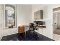 Dedicated office featuring a large window for natural light, built-in storage, and workstation at 7344 E Lindner Cir, Mesa, AZ 85209