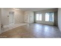 Spacious living room with tiled floors, large windows, and a bright, welcoming atmosphere at 8329 E Keim Dr, Scottsdale, AZ 85250
