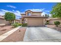 Charming two-story home with a well-manicured lawn and desert landscaping at 11301 W Glenrosa Ave, Phoenix, AZ 85037