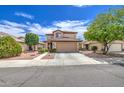 Inviting two-story home with a desert-style front yard and covered entry at 11301 W Glenrosa Ave, Phoenix, AZ 85037