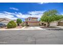 Inviting two-story home with a desert-style front yard and covered entry at 11301 W Glenrosa Ave, Phoenix, AZ 85037