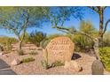 Granite Mountain Ranch community sign surrounded by desert landscaping at 14118 E Rancho Del Oro Ct, Scottsdale, AZ 85262