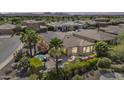 Backyard patio with landscaping, seating and mountain views at 1588 E Sweet Citrus Dr, Queen Creek, AZ 85140