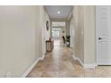 Hallway with tiled floors, neutral paint, and decor at 1588 E Sweet Citrus Dr, Queen Creek, AZ 85140