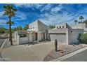 Contemporary home with desert landscaping, including saguaro cactus, and a two-car garage at 17289 E Kirk Ln, Fountain Hills, AZ 85268