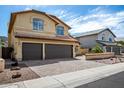 Charming two-story home with a tile roof, arched windows, and a well-manicured front yard at 20713 N 56Th Ave, Glendale, AZ 85308