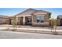 Inviting single-Gathering home features manicured gravel landscaping and a cozy, covered entrance at 22825 E Alyssa Rd, Queen Creek, AZ 85142
