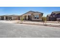 Inviting single-Gathering home features manicured gravel landscaping and a cozy, covered entrance at 22825 E Alyssa Rd, Queen Creek, AZ 85142