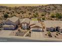Expansive aerial view of a suburban home displaying a desert landscaped yard and neighborhood setting at 2333 E Taxidea Way, Phoenix, AZ 85048