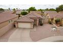 Charming single-Gathering home with a tile roof, two-car garage, and desert landscaping at 2397 E Winchester Pl, Chandler, AZ 85286