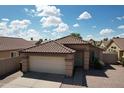 Beautiful home featuring a tile roof, neutral paint, and a two-car garage at 2397 E Winchester Pl, Chandler, AZ 85286
