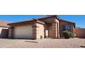 Charming single-story home with a well-maintained front yard and a two-car garage at 2397 E Winchester Pl, Chandler, AZ 85286