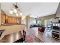 Open-concept living area with dining area, kitchen and lots of natural light at 2725 E Mine Creek Rd # 2058, Phoenix, AZ 85024