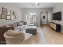Bright living room offers modern furnishings, hardwood floors, and a decorative rug at 3114 S Eugene --, Mesa, AZ 85212