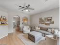 Inviting living room featuring hardwood floors, neutral tones, and comfortable, stylish furniture at 3114 S Eugene --, Mesa, AZ 85212
