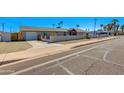 Inviting home with a well-kept exterior, featuring a garage and a combination of wall and fencing at 3601 N 12Th St, Phoenix, AZ 85014