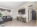 Inviting living room with a modern TV, comfortable seating, and bright natural light at 3645 N 69Th Ave # 12, Phoenix, AZ 85033