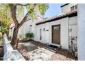 Charming home exterior with a brown front door, a lovely tree, and a well-maintained yard at 5350 N 3Rd Ave, Phoenix, AZ 85013