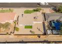 Aerial shot of a fenced property featuring a well-maintained roof and a small green lawn at 6610 N 15Th Ave, Phoenix, AZ 85015