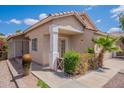 Charming single story home with a well maintained front yard featuring desert landscaping and a cozy entrance at 8010 W Adam Ave, Peoria, AZ 85382