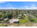 Aerial view of a home and land with horse facilities at 944 E Melody Dr, Gilbert, AZ 85234