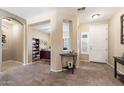 Welcoming foyer leading to a home office with neutral colors and an open floor plan at 1115 E Locust Dr, Chandler, AZ 85286