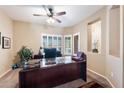 Comfortable home office with plantation shutters, natural light, and plenty of workspace at 1115 E Locust Dr, Chandler, AZ 85286