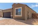 Charming single-story home with a two-car garage and low maintenance desert landscaping at 1239 E Elaine St, Casa Grande, AZ 85122