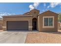 Charming single-story home with a two-car garage and low maintenance desert landscaping at 1239 E Elaine St, Casa Grande, AZ 85122