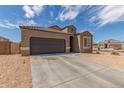 Charming single-story home with a two-car garage and low maintenance desert landscaping at 1239 E Elaine St, Casa Grande, AZ 85122