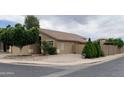 Picture of a well-maintained property with manicured landscaping, adding curb appeal to this inviting residence at 13031 W Surrey Ave, El Mirage, AZ 85335