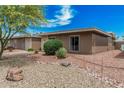 Charming single-story home with desert landscaping, rock ground cover, and a beautiful blue sky at 13821 N Thunderbird Blvd, Sun City, AZ 85351