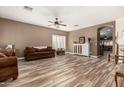 Spacious living room features beautiful floors and a neutral color palette at 14282 W Indianola Ave, Goodyear, AZ 85395