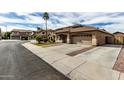 A beautiful desert home with great curb appeal featuring a two-car garage at 14282 W Indianola Ave, Goodyear, AZ 85395