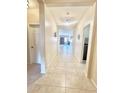 Inviting hallway with neutral tones, tile flooring, and recessed lighting, creating a seamless flow throughout the home at 1516 E Azalea Dr, Gilbert, AZ 85298