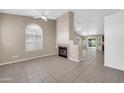 Spacious living room with a fireplace and open layout, perfect for entertaining at 1835 E Marquette Dr, Gilbert, AZ 85234