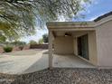 Covered patio with a ceiling fan overlooking desert landscaped backyard, great for relaxing at 2042 N Parish N Ln, Casa Grande, AZ 85122