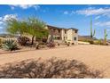 Picturesque desert property with mature trees and landscaping, offering a tranquil and inviting setting at 3723 S Pottery Rd, Gold Canyon, AZ 85118