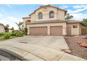 Charming two-story home with a two-car garage, desert landscaping, and mature trees at 5839 W Ironwood Dr, Glendale, AZ 85302