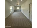Versatile bonus room with plush carpeting, built-in storage, and a window for natural light at 6337 W Deer Valley Rd, Glendale, AZ 85308