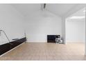 Spacious, bright living room with vaulted ceilings, neutral tile flooring and fresh white paint, ready for your personal touch at 15801 N 29Th St # 16, Phoenix, AZ 85032