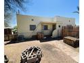 A single Gathering home with a partially xeriscaped yard featuring a DIY fire pit and a ladder at 1731 E Moreland St, Phoenix, AZ 85006