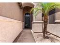 Close-up of a decorative front door and a well-maintained desert landscape at 198 N Nevada Way, Gilbert, AZ 85233